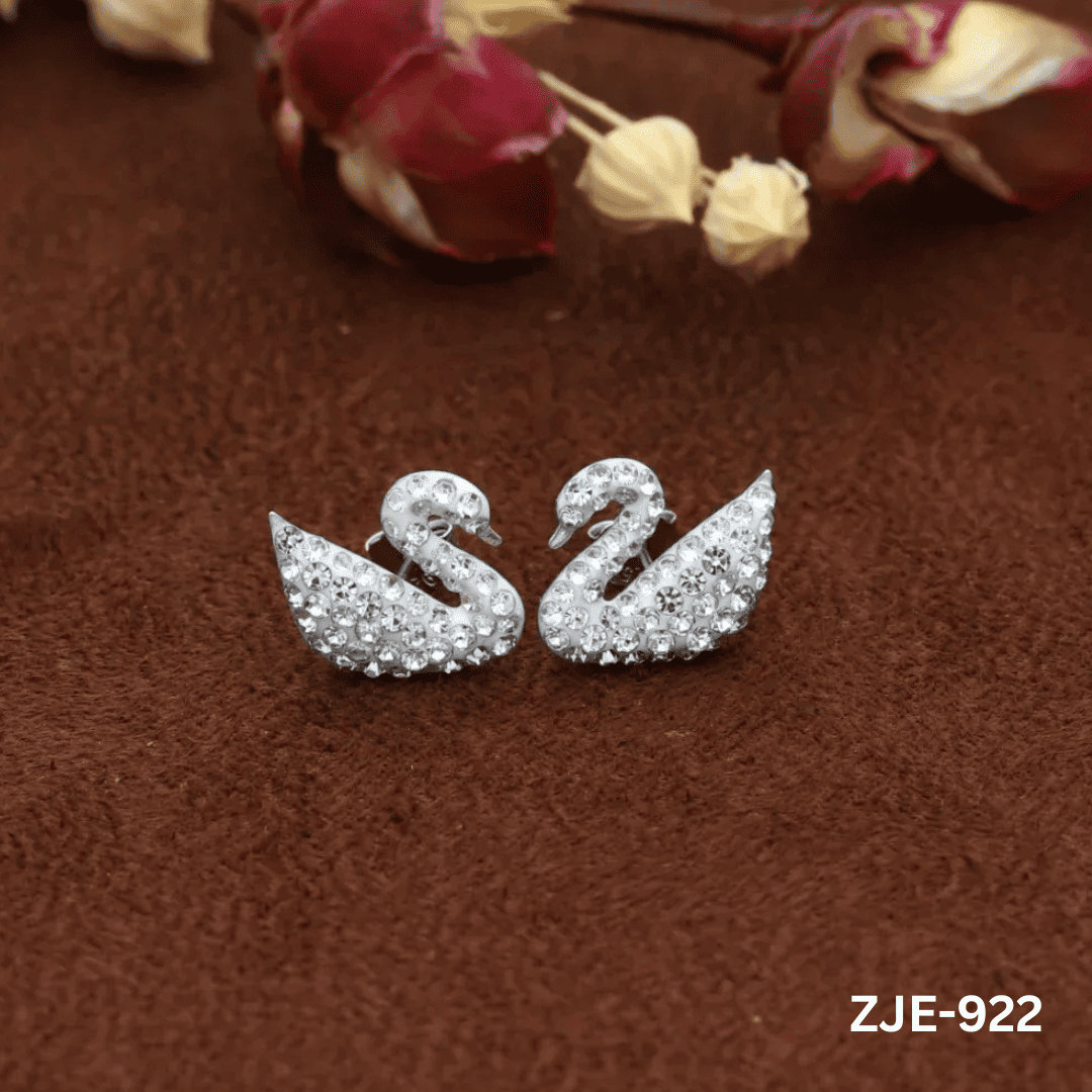 ZJE-922 White Sparkling Swan Earrings By BSM - BSM WHOLESALE