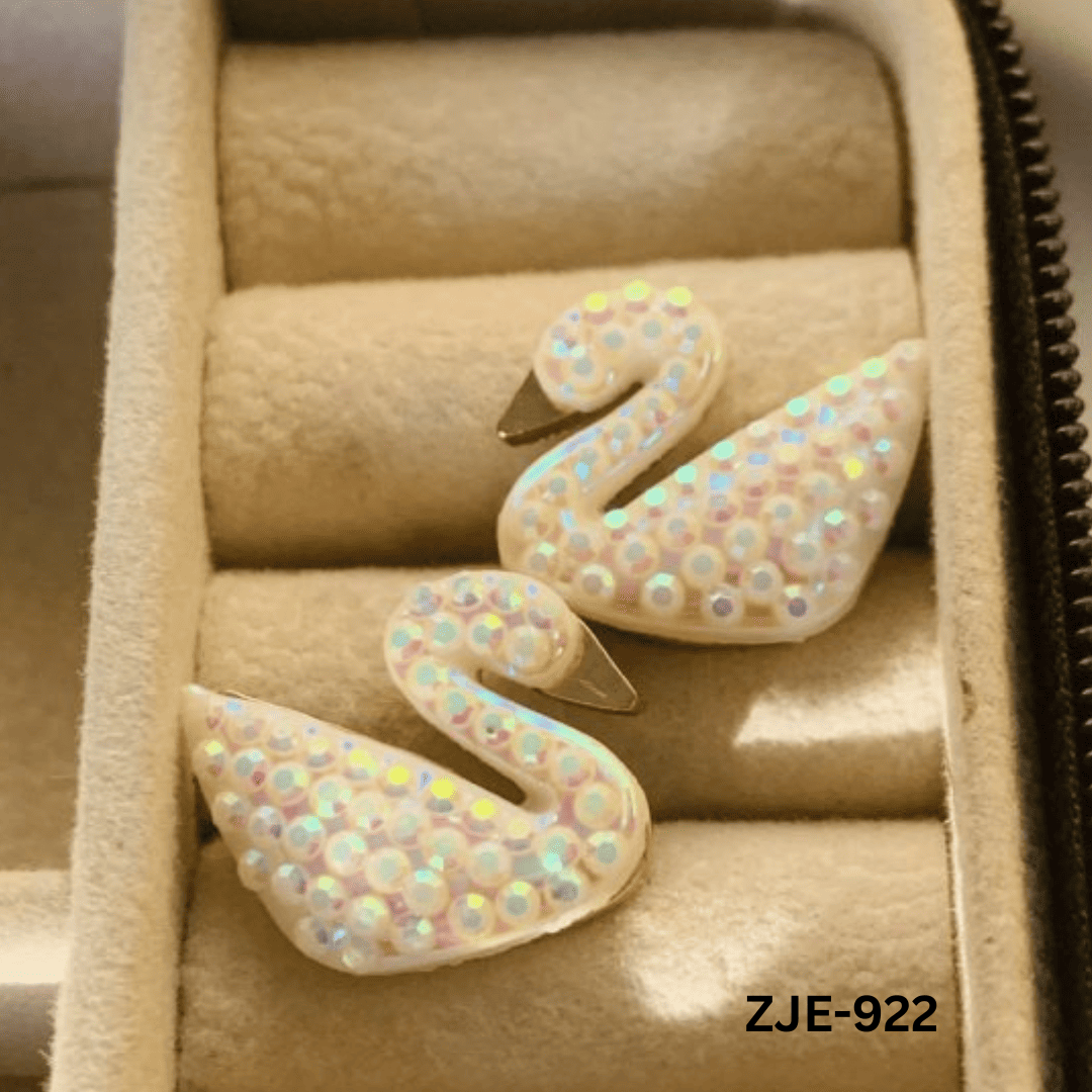 ZJE-922 White Sparkling Swan Earrings By BSM - BSM WHOLESALE
